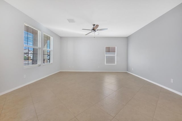 spare room with ceiling fan