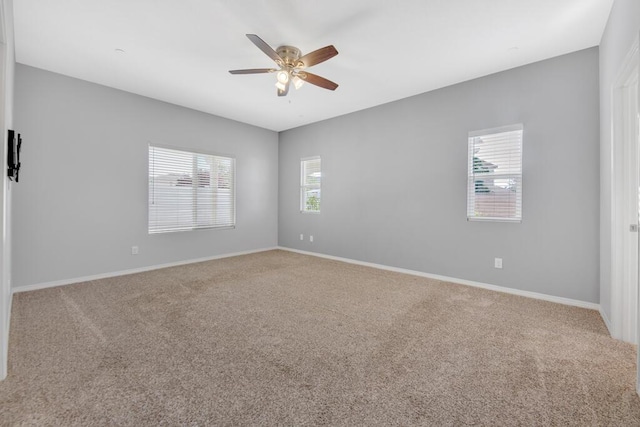 carpeted empty room with ceiling fan