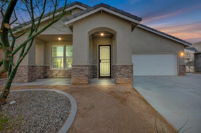 view of front of home with a garage