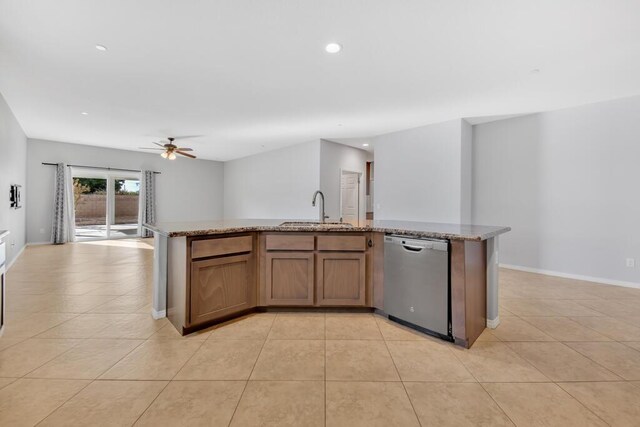 kitchen featuring ceiling fan, dishwasher, an island with sink, and sink