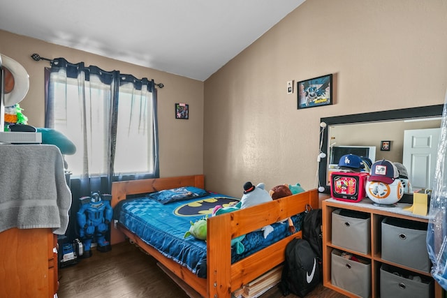 bedroom featuring dark hardwood / wood-style floors