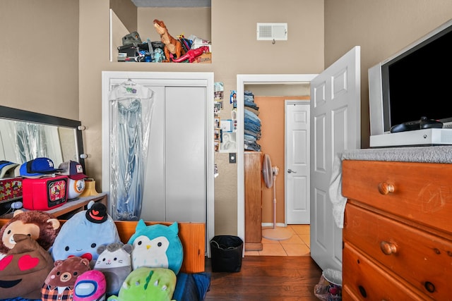 bedroom with a closet and wood-type flooring