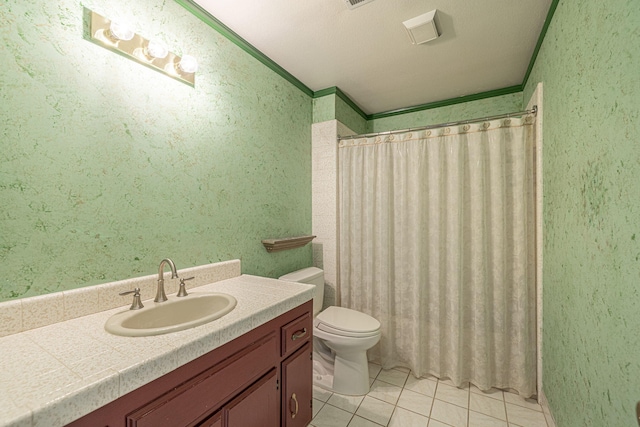 bathroom featuring curtained shower, ornamental molding, vanity, toilet, and tile patterned floors