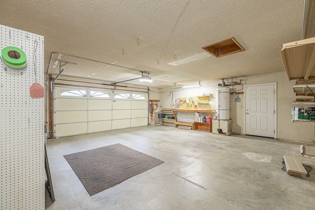 garage with a garage door opener and water heater