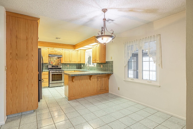 kitchen with extractor fan, pendant lighting, a breakfast bar area, kitchen peninsula, and stainless steel appliances