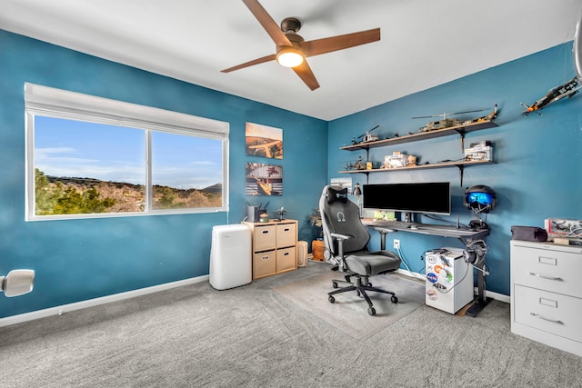 office space featuring carpet, ceiling fan, and baseboards