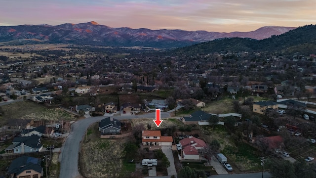 aerial view at dusk with a residential view and a mountain view