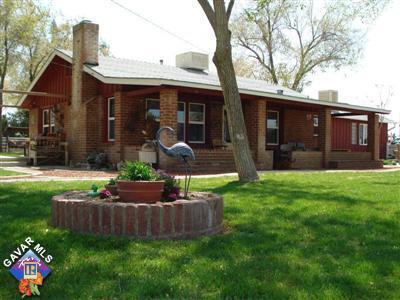 back of house with a yard