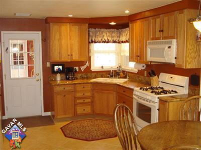 kitchen featuring white appliances and sink