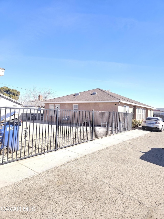 45019 Division St, Lancaster, CA 93535 - view of front of house featuring a fenced front yard and stucco siding