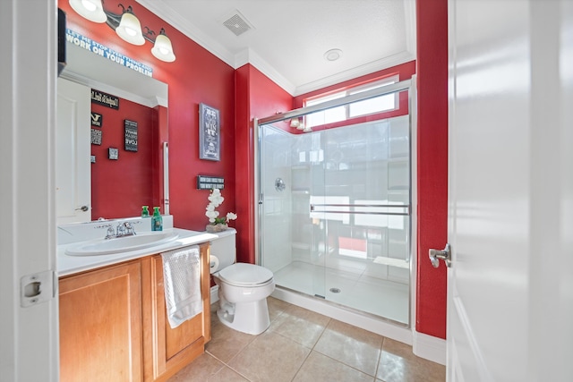 bathroom featuring tile patterned floors, toilet, a shower with shower door, crown molding, and vanity