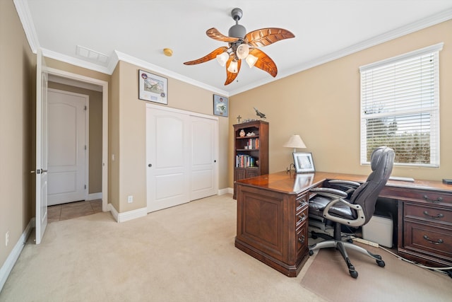 home office with ornamental molding, light carpet, and ceiling fan