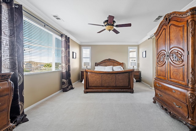 bedroom featuring crown molding, light carpet, and ceiling fan