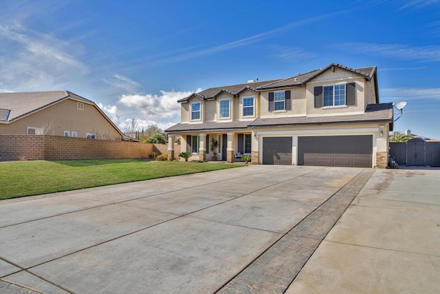 view of front of house with a garage, covered porch, and a front lawn