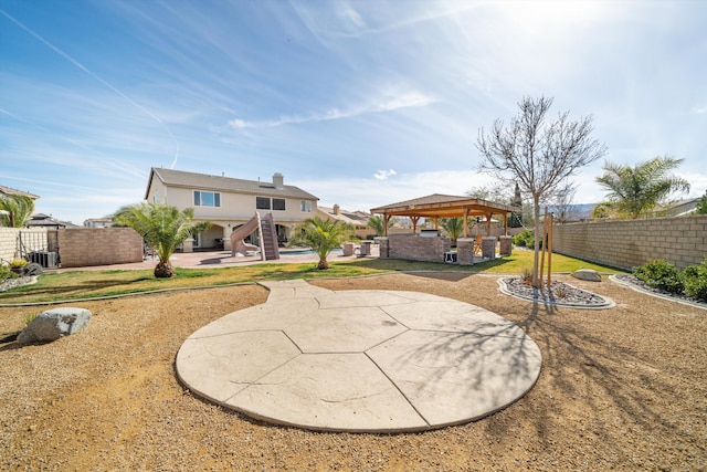 exterior space featuring a gazebo, a patio area, and central air condition unit