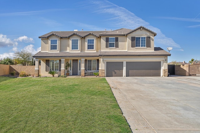 view of front facade with a garage and a front yard