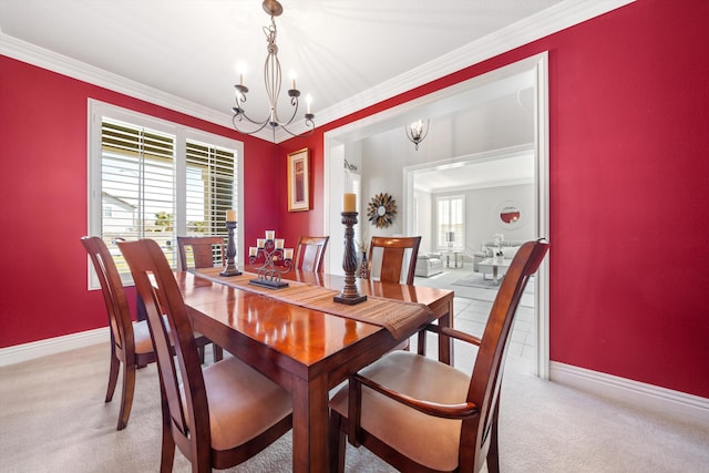 carpeted dining area with crown molding, a wealth of natural light, and a chandelier