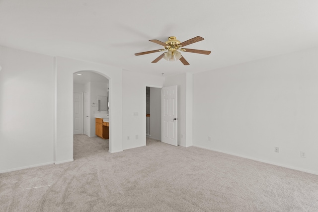 4349 Bethpage Dr, Palmdale, CA 93551 - unfurnished bedroom with arched walkways, light carpet, ensuite bath, and ceiling fan