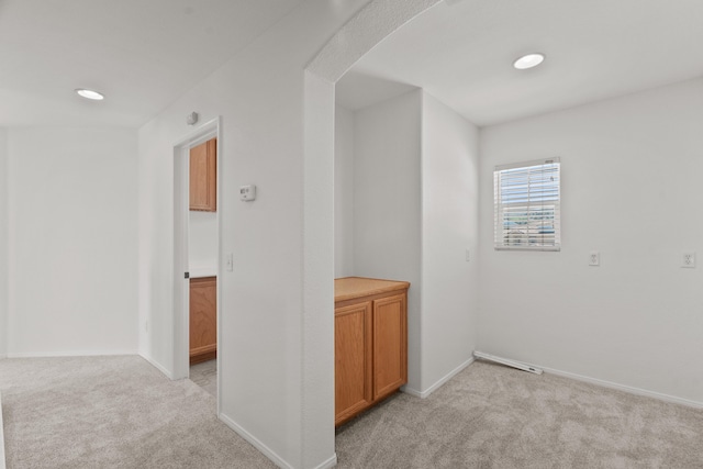 4349 Bethpage Dr, Palmdale, CA 93551 - unfurnished room with light colored carpet, arched walkways, baseboards, and recessed lighting