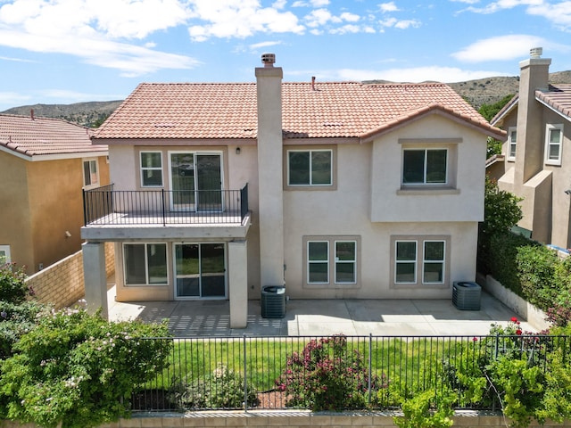4349 Bethpage Dr, Palmdale, CA 93551 - back of house with stucco siding, a tiled roof, and a patio area
