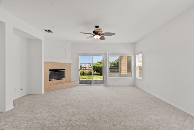 4349 Bethpage Dr, Palmdale, CA 93551 - unfurnished living room featuring carpet, a fireplace, a ceiling fan, and baseboards