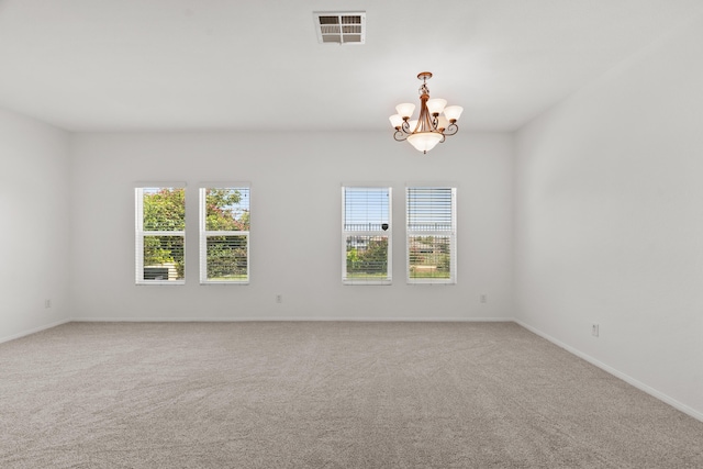 4349 Bethpage Dr, Palmdale, CA 93551 - empty room featuring a chandelier, light carpet, and baseboards