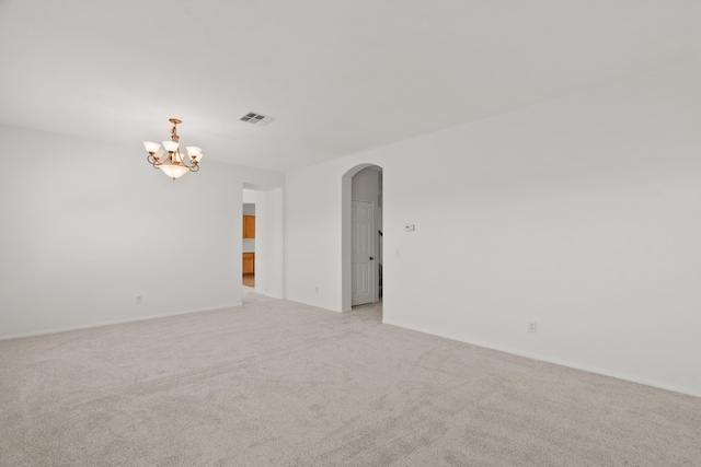 4349 Bethpage Dr, Palmdale, CA 93551 - unfurnished room featuring arched walkways, light carpet, a chandelier, and baseboards