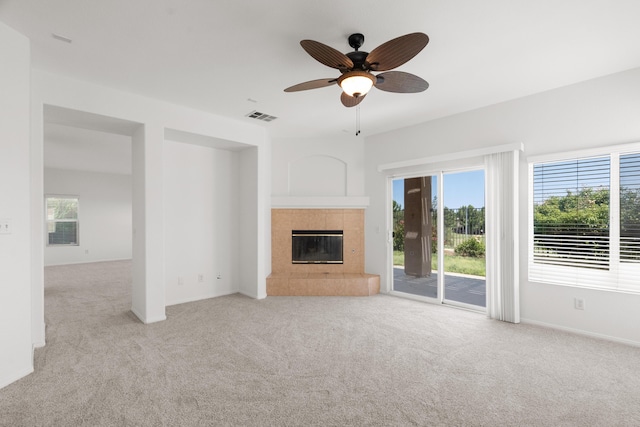 4349 Bethpage Dr, Palmdale, CA 93551 - unfurnished living room featuring carpet, a fireplace, plenty of natural light, and ceiling fan