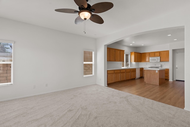 4349 Bethpage Dr, Palmdale, CA 93551 - kitchen featuring white microwave, open floor plan, a sink, dishwasher, and recessed lighting
