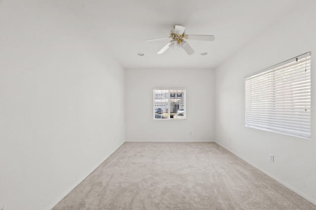 4349 Bethpage Dr, Palmdale, CA 93551 - empty room featuring light colored carpet, a ceiling fan, and baseboards