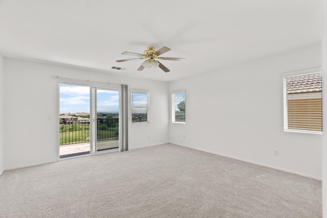 4349 Bethpage Dr, Palmdale, CA 93551 - spare room with a ceiling fan, light carpet, and baseboards