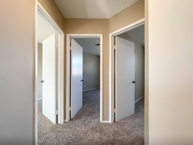 corridor featuring carpet flooring