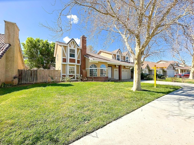 view of front of home featuring fence, driveway, a chimney, a front lawn, and a garage