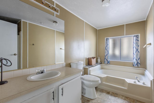 bathroom with vanity, a bath, a textured ceiling, and toilet