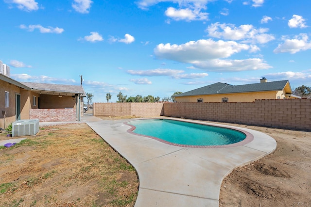 view of swimming pool with central AC unit, a fenced backyard, and a fenced in pool