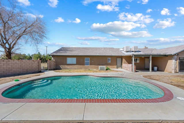 view of pool with a patio, central air condition unit, fence, a gate, and a fenced in pool