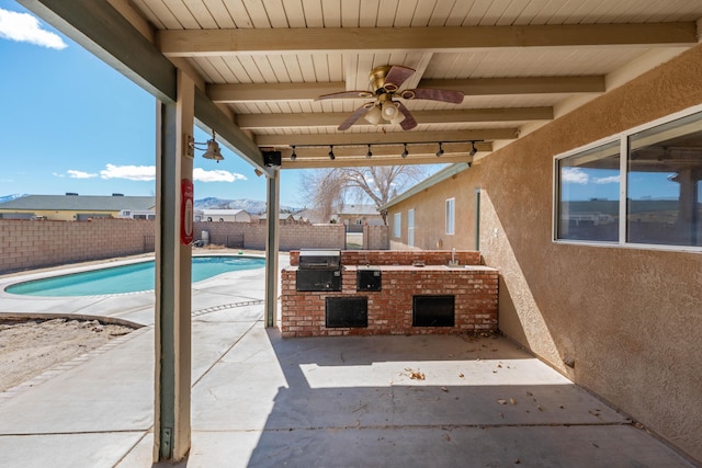 view of patio / terrace with a fenced backyard, a grill, a ceiling fan, exterior kitchen, and a fenced in pool