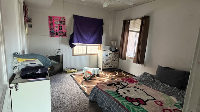 bedroom featuring ceiling fan and carpet floors