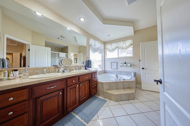 bathroom with tile patterned flooring, vanity, and independent shower and bath