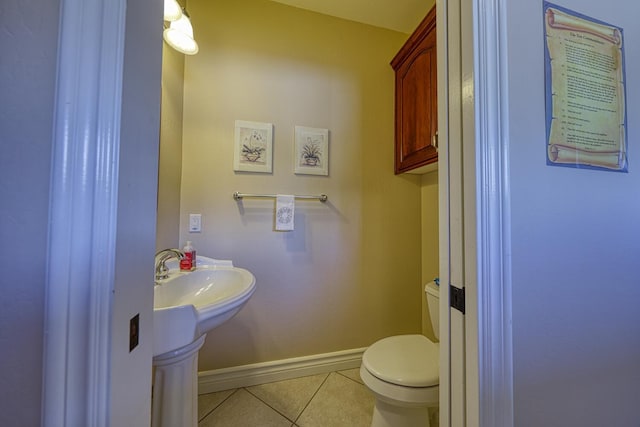 bathroom with tile patterned floors and toilet