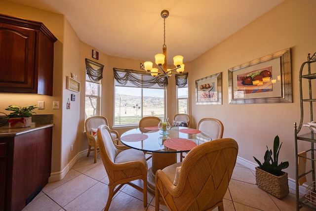 dining area with light tile patterned floors and a notable chandelier