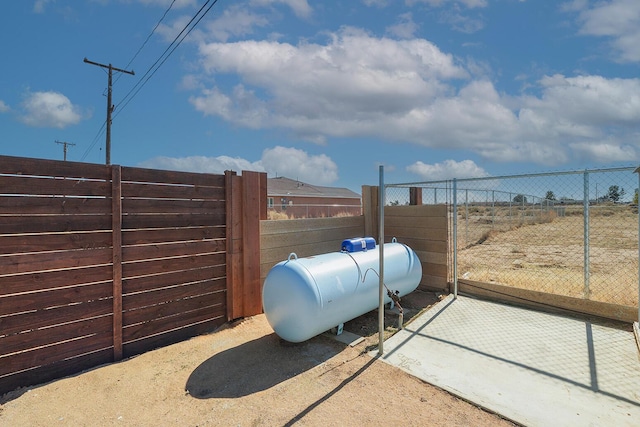 view of gate with fence