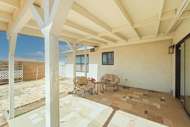 view of patio / terrace featuring fence