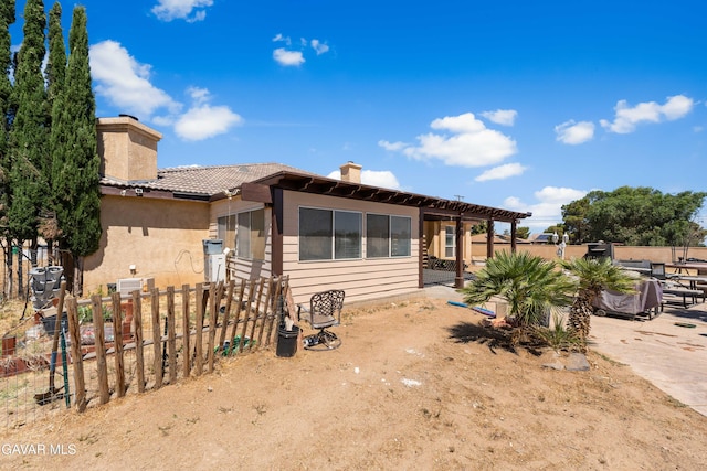 42094 W 21st St, Lancaster, CA 93536 - view of front of property featuring a chimney, a patio, a pergola, and stucco siding