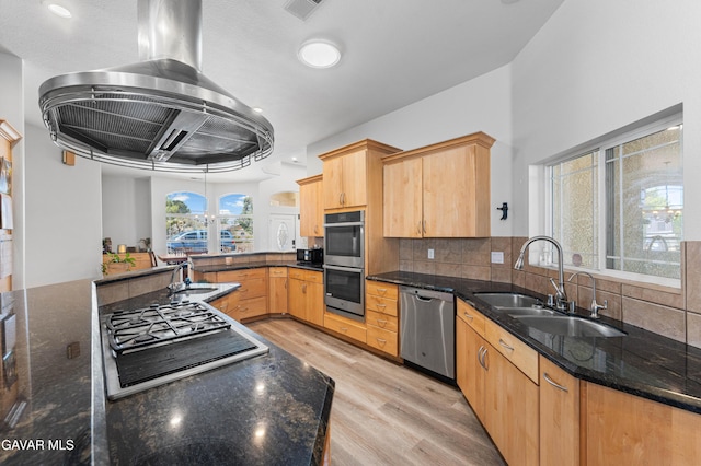 42094 W 21st St, Lancaster, CA 93536 - kitchen featuring stainless steel appliances, ventilation hood, light wood finished floors, and dark stone counters