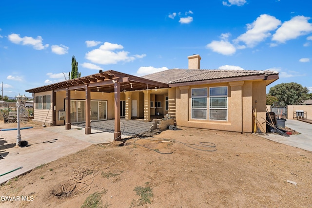 42094 W 21st St, Lancaster, CA 93536 - back of house with a patio, a tile roof, stucco siding, and a chimney