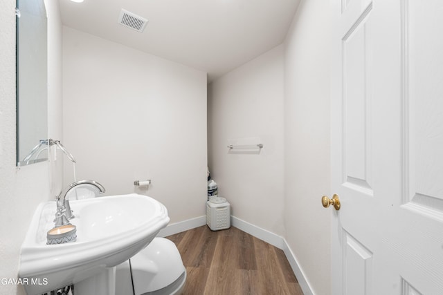 42094 W 21st St, Lancaster, CA 93536 - bathroom with wood finished floors and baseboards