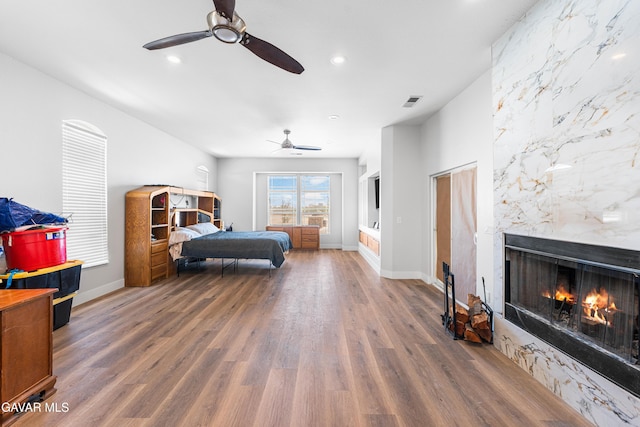42094 W 21st St, Lancaster, CA 93536 - bedroom with wood finished floors, a premium fireplace, recessed lighting, and ceiling fan