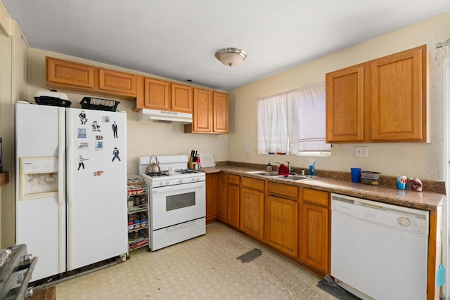 kitchen featuring white appliances and sink