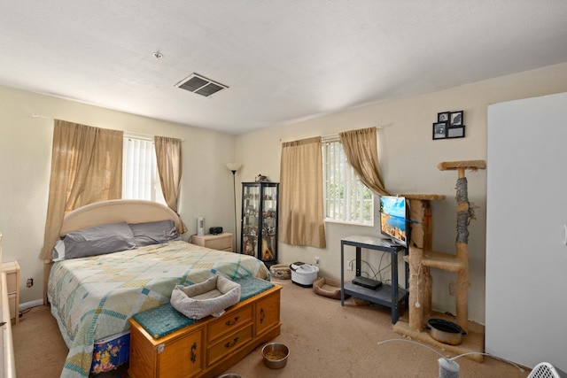 bedroom featuring light carpet